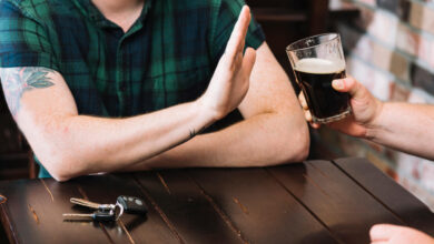 Image of a man refusing an alcoholic beverage - Why Reducing Alcohol Matters: Benefits and Strategies